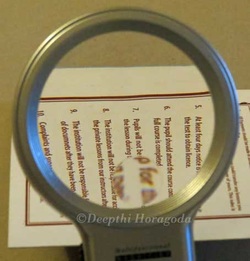 Demonstration of magnification power of LED magnifying lamp.